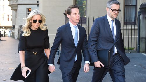 Jackeno heading to court with husband Oliver Curtis (centre). (AAP)