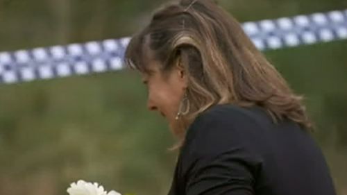 A woman was seen crying near where the body was found. (9NEWS)