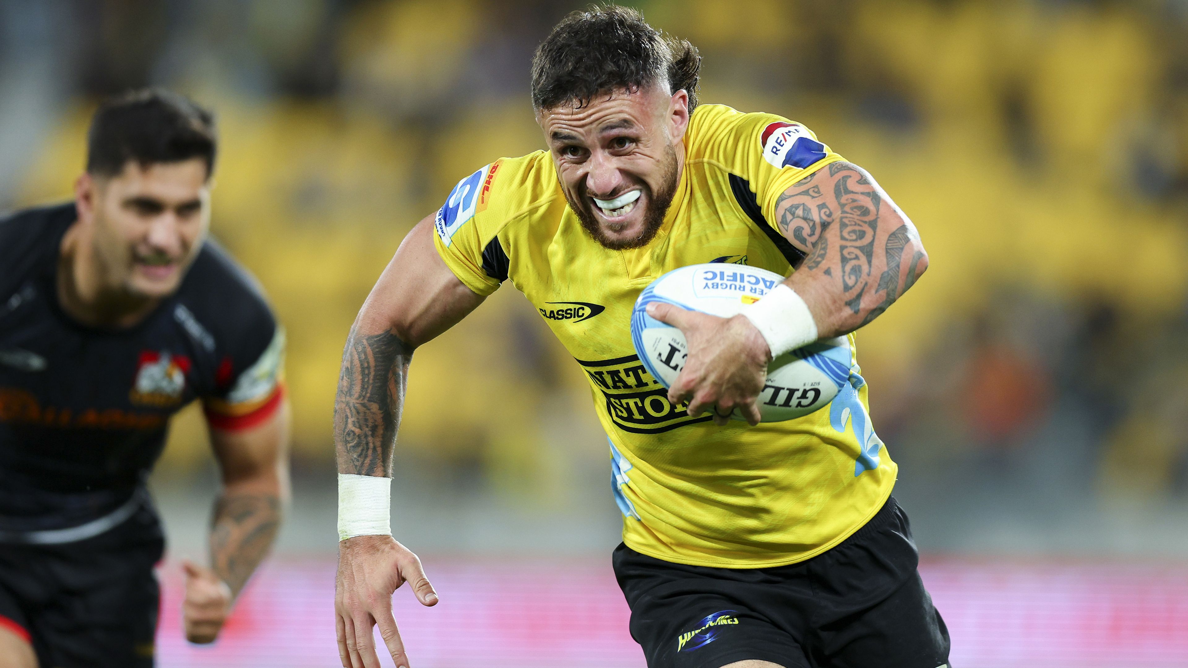 TJ Perenara of the Hurricanes breaks away for a try.