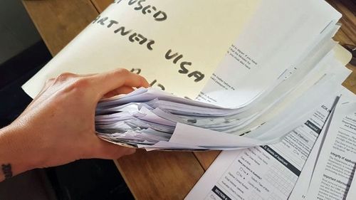 A red tape nightmare: Ms Sanchez's 'partner visa' folder. (Facebook)