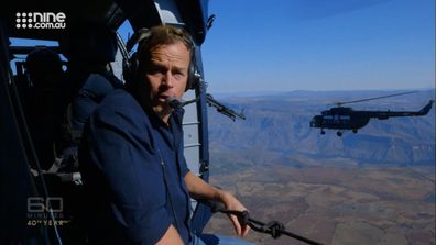 On the edge of a Black Hawk chopper, Tom Steinfort had no idea where federal police were headed when they told him to come along for the ride.