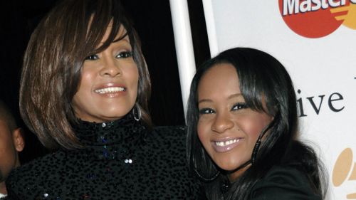 Bobbi Kristina Brown (right) with her mother Whitney Houston. (AAP)