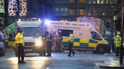 Emergency services at Glasgow's George Square after a garbage truck crashed into pedestrians. (AAP)