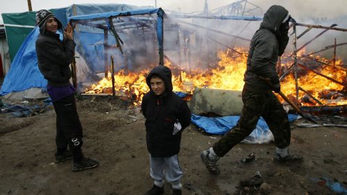Migrants protest amid camp demolition at Calais jungle