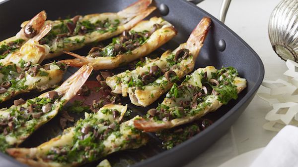Grilled split prawns with parsley, lemon and olive salsa