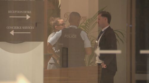 A woman has been charged with allegedly stabbing her coworker with scissors in what police have described as a﻿ "frenzied" attack at a luxury hotel in Sydney CBD.