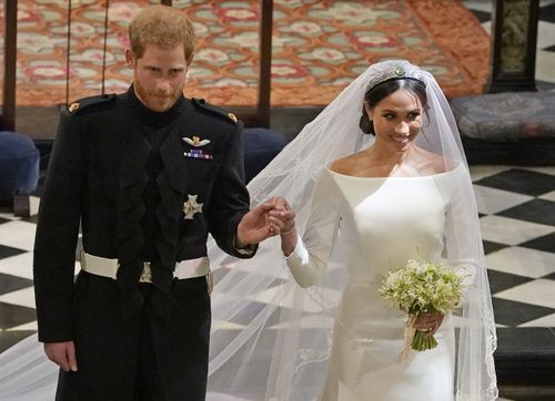 The married couple leave St George's Chapel after the ceremony. Picture: PA