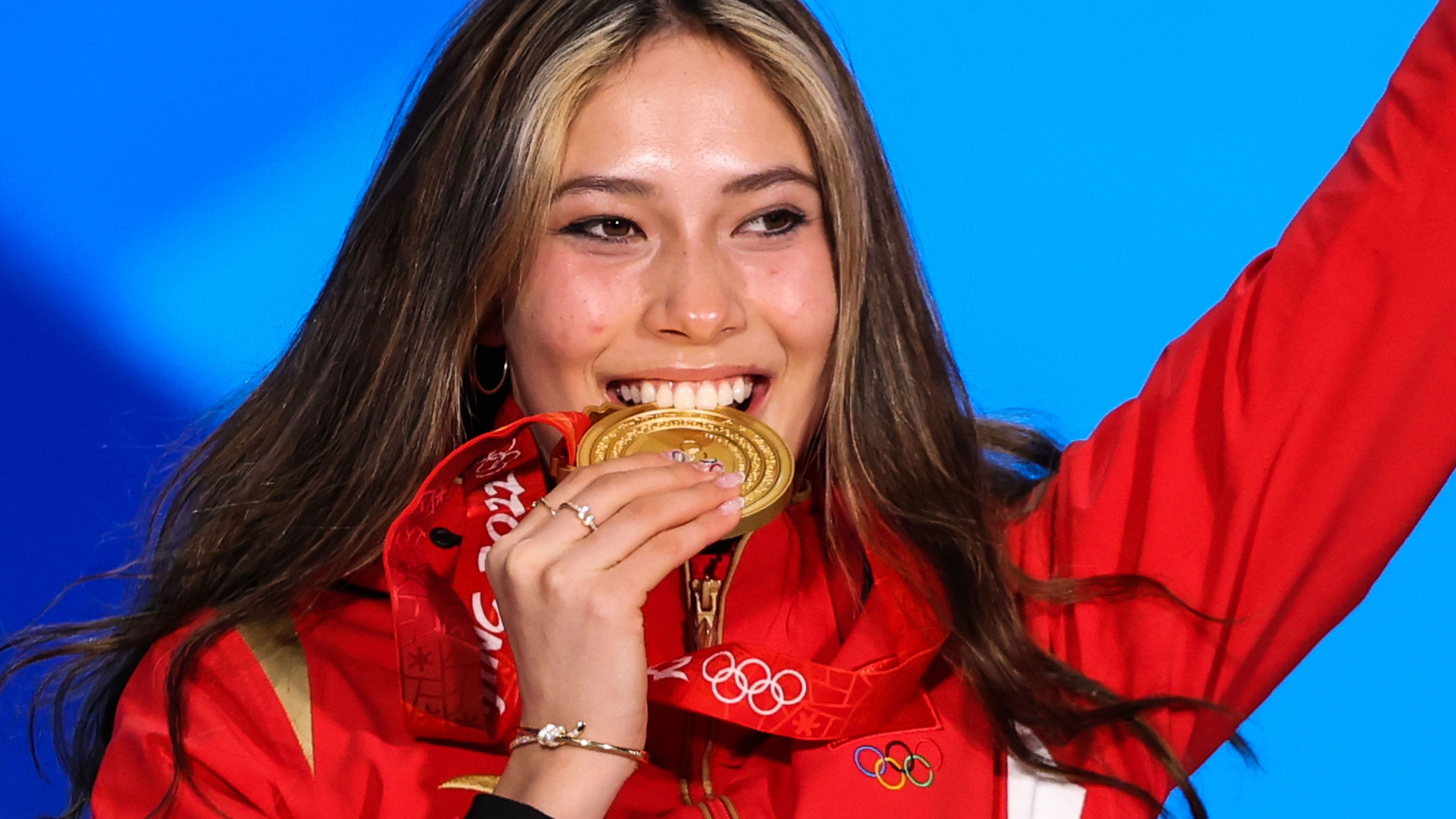 Representing China, Eileen Gu  poses with her gold medal after winning the women&#x27;s freestyle skiing freeski big air event at the Beijing Winter Olympics.