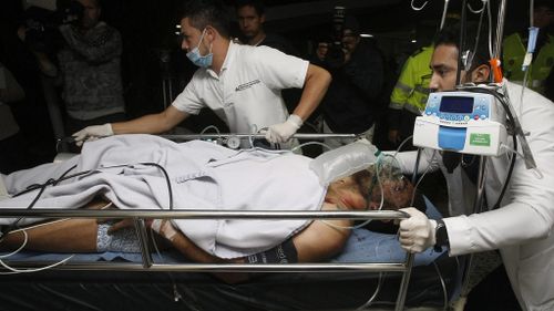 Chapecoense player Alan Ruschel arrives at hospital after the crash. (AAP)