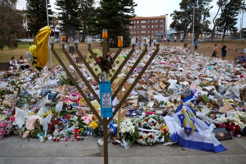 SYDNEY, AUSTRALIA - DECEMBER 21: General view of the memorial at Bondi Pavilion on December 21, 2025 in Sydney, Australia. Life slowly returned to normal at Bondi Beach, with people from all walks of life still paying respects and tributes as raw grief and funerals gave way to quiet commemorations. Police say at least 16 people, including one suspected gunman, were killed and more than 40 others injured when two attackers opened fire near a Hanukkah celebration at the world-famous Bondi Beach, i