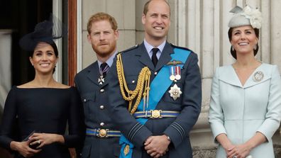 Meghan the Duchess of Sussex, Prince Harry, Prince William and Kate the Duchess of Cambridge, as they watch a flypast of Royal Air Force aircraft pass over Buckingham Palace in London. 