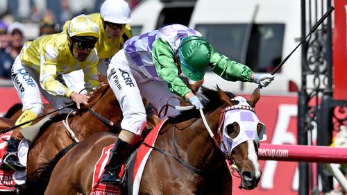 Jockey Michelle Payne riding Prince Of Penzance crosses the finish line to win the $6,000,000 Melbourne Cup race at Flemington Racecourse. (AAP)
