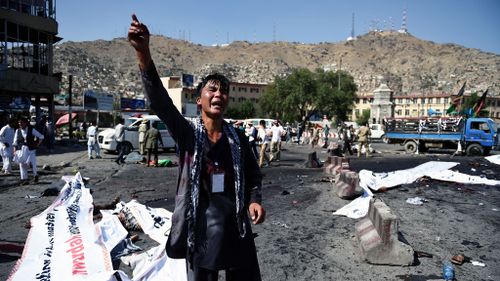 An Afghan protester screams near the scene of a suicide attack that targeted crowds of minority Shiite Hazaras during a demonstration at the Deh Mazang Circle in Kabul on July 23, 2016. (AFP)