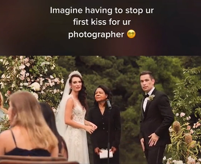Wedding photographer interrupts couple mid first-kiss
