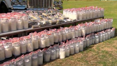 The seized meth and cash lined up at a press event from WA Police.