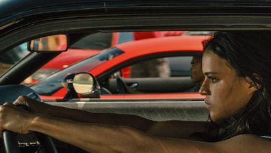 Michelle Rodriguez in the movie Fast and the Furious in a car