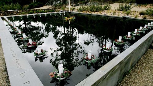  Floating candles for each of those killed in the Port Arthur massacre lie in the reflection pool at the memorial site during a commemoration service to mark the 10th anniversary of the massacre in Port Arthur. (AAP)