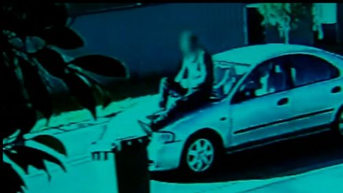 Video emerged of a man sitting on the bonnet of a vehicle while driving through an Adelaide street. Picture: Supplied