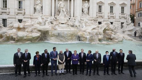 Leaders of the G20 pose in front of the during Trevi Fountain during an event for the G20 summit in Rome, Sunday, October 31, 2021.(AP Photo/Gregorio Borgia)