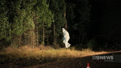 Police searching bushland. (9NEWS)