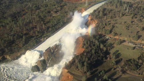 Thousands of people have been evacuated after water began overflowing at the tallest dam in the United States. (AAP)