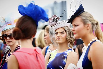 Fascinators, hats, bright colours, hair and make-up perfectly arranged. (AAP)