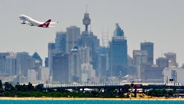 A Qantas plane takes off from Sydney Airport.