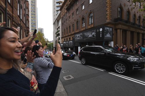 Crowds gathered to try to catch a glimpse of Obama as he arrived in a security motorcade (AAP)