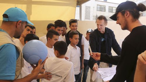 Neeson and his son Michael spent two days at Za'atari refugee camp. (AAP) 