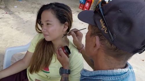 Henna tattoos are a popular tourist attraction in Kuta.