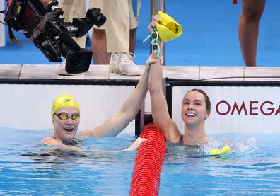 Emma McKeon is congratulated by teammate Cate Campbell after winning gold medal in the Women's 100m Freestyle Final photo.