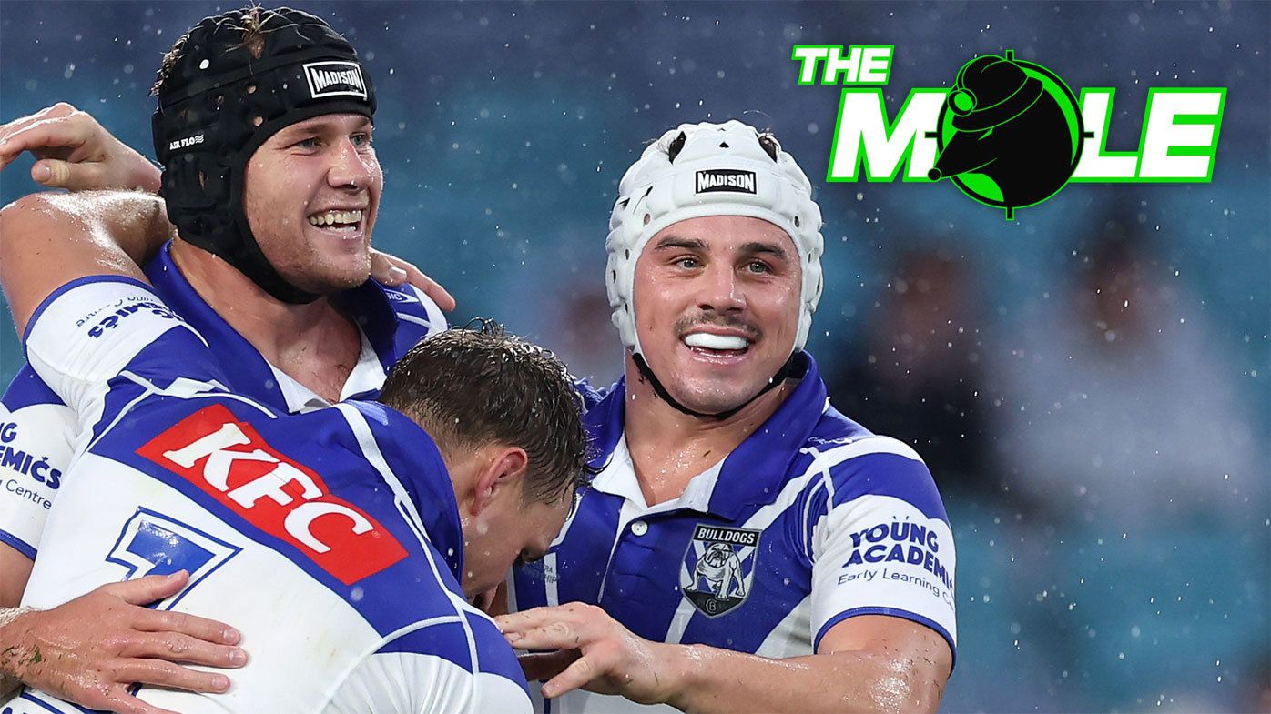 Matt Burton and Reed Mahoney celebrate a Bulldogs try against the Roosters.