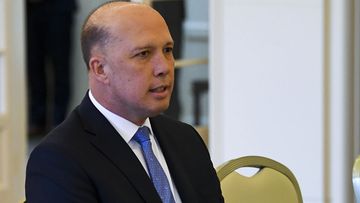 Liberal MP Peter Dutton is sworn in as Home Affairs Minister by Australian Governor-General Sir Peter Cosgrove during a ceremony at Government House in Canberra.