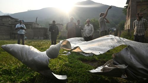 The wreckage of an aircraft is seen in Wuyan, a village in Indian-administered Kashmir, on May 7, 2025.