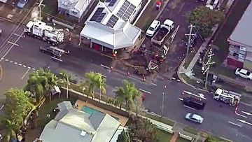 Residents of a suburban Brisbane street have told of how they awoke to their homes and backyards being flooded after a burst water main caused a sinkhole this morning