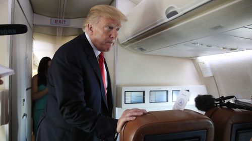President Donald Trump on Air Force One. (AAP)