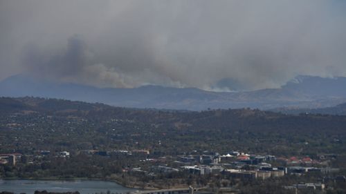 A bushfire burning south near the town of Tharwa, 30km south of Canberra