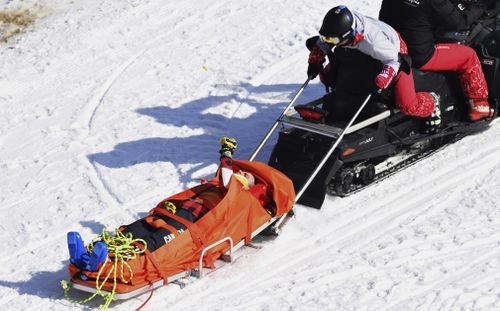 He was able to wave to onlookers as he was taken to hospital. (AAP)