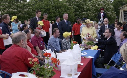 Queen Elizabeth II Talking With Some Of Her Guests At The Party In The Garden Of Buckingham Palace To Mark The 50th Anniversary Of Her Coronation.