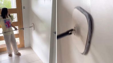 Corinne Mayfair mops her wall with the dual section spin mop set she purchased from Kmart