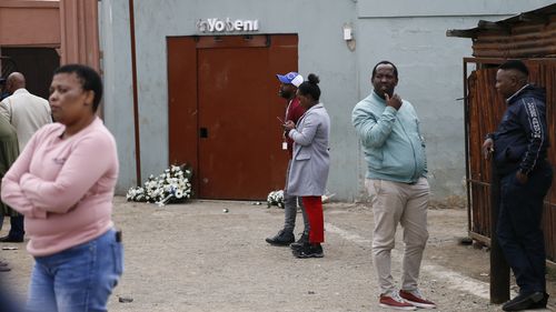 Wreaths lays outside the Enyobeni Tavern in Scenery Park, East London South Africa, Tuesday, July 5, 2022 where 21 teenagers lost their lives almost two weeks ago. South African President Cyril Ramaphosa is to attend the funeral Wednesday for the teenagers who died in a mysterious tragedy at the tavern. (AP Photo)