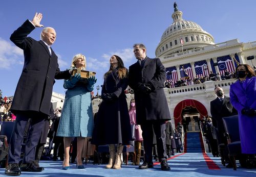 Joe Biden is sworn in as the 46th President of the United States at the Capitol in Washington on Wednesday, Jan. 20, 2021, as his wife Jill Biden holds a bible and his daughter Ashley Biden and son Hunter Biden look on. (Andrew Harnik/Pool via The New York Times) -- FOR EDITORIAL USE ONLY --