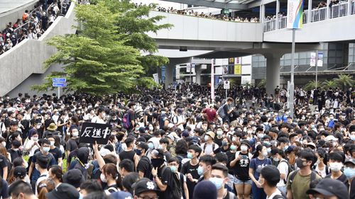 Tens of thousands of protesters against China's extradition law, a bill to extradite prisoners to mainland China occupy a road and street to the Legislative Council, in Hong Kong.