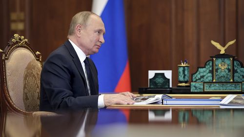 Russian President Vladimir Putin attends a meeting the Kremlin in Moscow, Russia.