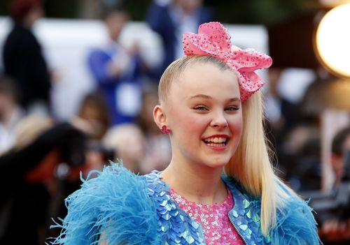 The 15-year-old brought her signature style- and hair bow- to the Logies red carpet on Sunday. (AAP)