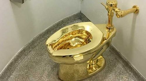 Gold toilet opens for business at Guggenheim