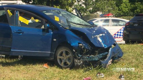 The 72-year-old woman accused of driving down the wrong side of the road was rushed to hospital with abdominal and chest injuries. (9NEWS)