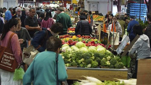 A general photo of people shopping for fruit and vegetables at the Queen Vic Market on Friday, December 2, 2023. inflation consumer economy