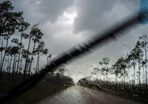 A car returns to the capital under the previous rain before the arrival of Hurricane Dorian in Freeport, Grand Bahama, Bahamas