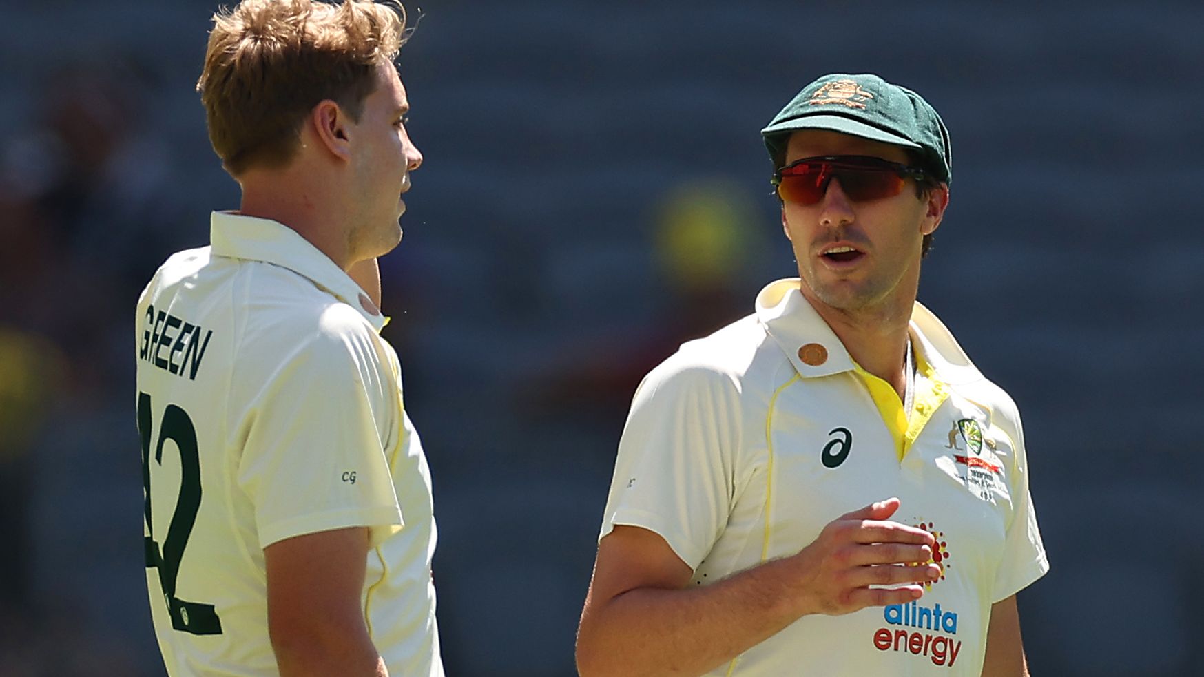 PERTH, AUSTRALIA - DECEMBER 02: Cameron Green of Australia speaks to Pat Cummins during day three of the First Test match between Australia and the West Indies at Optus Stadium on December 02, 2022 in Perth, Australia. (Photo by Cameron Spencer/Getty Images)